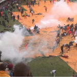 Kenya police fire shots at crowds gathered to see body of ex-PM Odinga