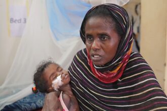 ‘I can’t afford to save both twins’: Sudan’s war left one mother with an impossible choice