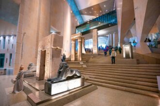 What are the must-see exhibits and surrounding attractions at the Grand Egyptian Museum for travelers right now?
